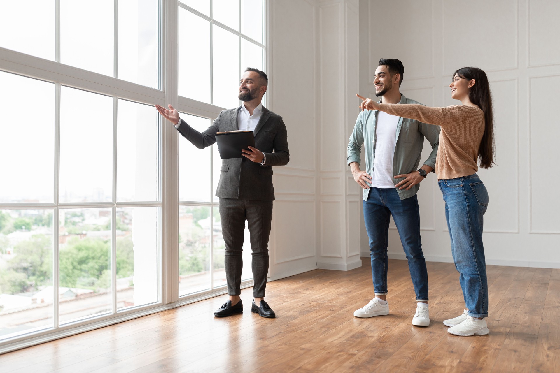 Estate Agent Showing Prospective Buyers Around Property